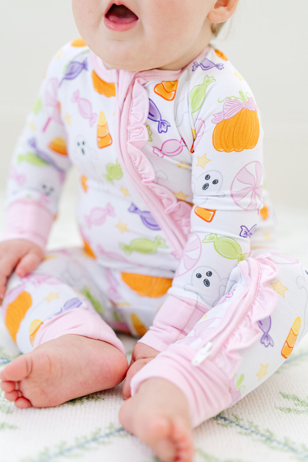 Spooky Sweet Ruffle Zipper Onesie – Pink